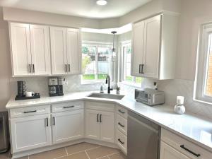 Kitchen sink in a corner with a window in Southgate